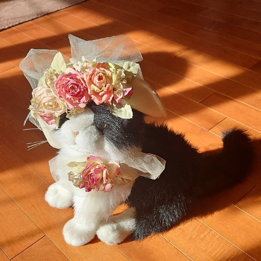 Black and White Plush Cat with flowered hat.